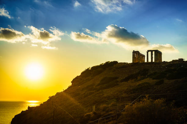 Greece Cape Sounion. Ruins of an ancient temple of Poseidon, Greek god of the sea, at sunset. Travel destinations.