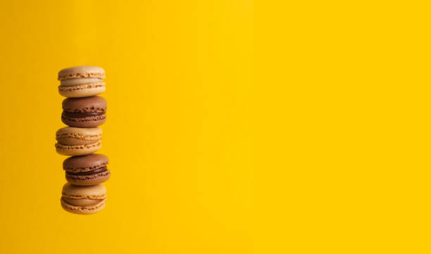 istock French sweet macaron cookies on a yellow background close-up copy space 1455509019