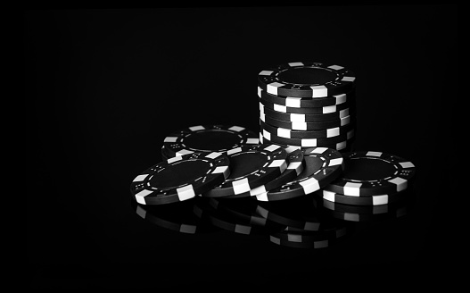 One man, gentlemen playing poker in dark room at night.