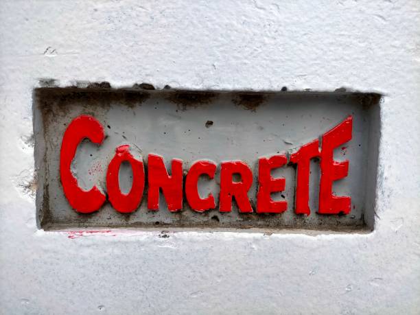 istock Concrete word cast in concrete with raised letters painted in red. 1455513786