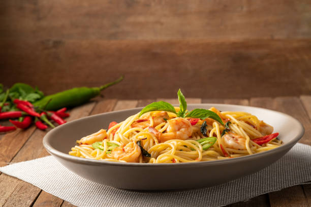 istock stir fried spicy spaghetti with shrimp and basil 1455516627