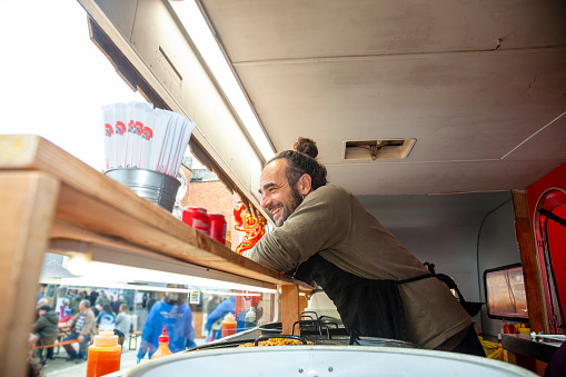 Chef serving customers in the food truck