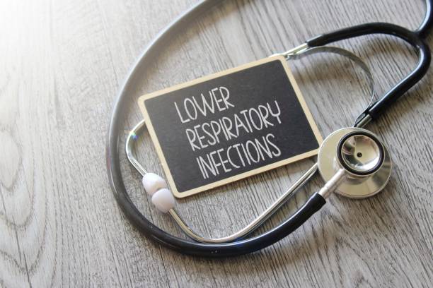 istock Stethoscope and chalkboard with text LOWER RESPIRATORY INFECTIONS on wooden table 1455522240