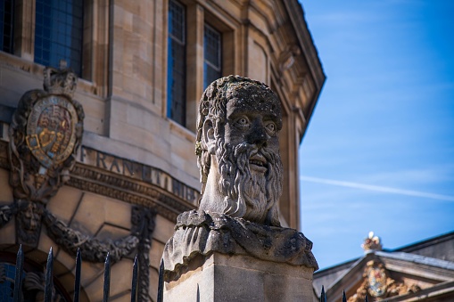 Oxford, United Kingdom - April 15, 2022: Emperor Head by sculptor William Byrd on Oxford's Sheldonian Theatre