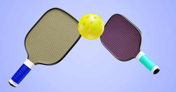 istock Pickleball two rackets and one ball. 3D rendering 1455526098