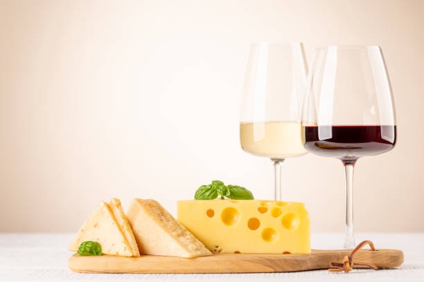 various cheese on board, red and white wine - cheese emmental cheese swiss culture cutting board imagens e fotografias de stock