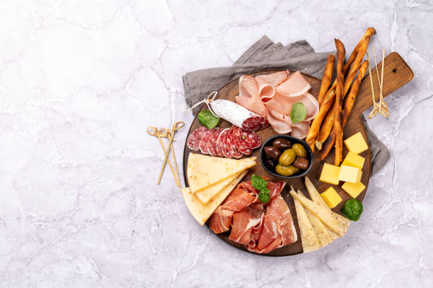 istock Antipasto board with various meat and cheese snacks 1455527790