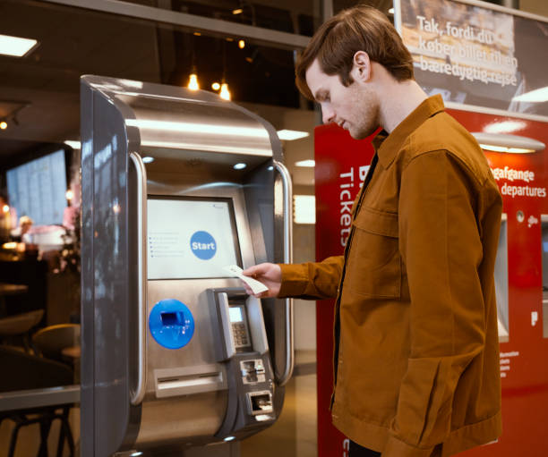 istock Commuter buying ticket for the train 1455528923