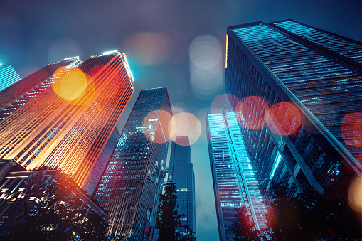 City skyscraper with light bokeh\nStockmarket and investment theme background