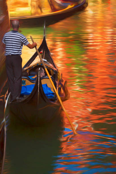 Gondlier and Gondola on the canals of Venioce Italy.