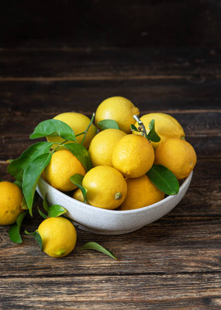 istock Fresh lemons in a bowl on the table 1455536289