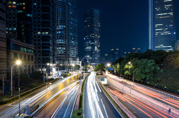 istock Busy night traffic in modern city 1455536386