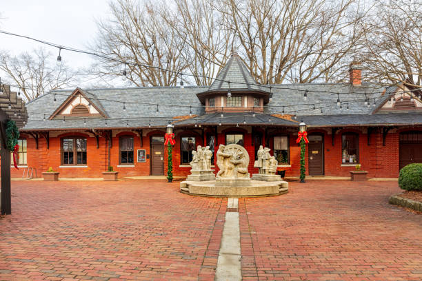 Burlington, NC, USA-2 Jan 2023: Historic Burlington Train Depot with carved depictions of historical events in front.
