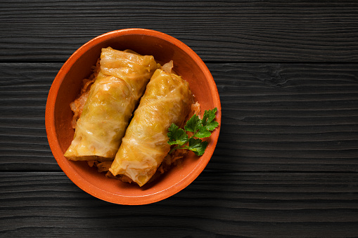 Traditional balkan food Sarma or stuffed cabbage. Cabbage leaves filled with minced meat and rice.