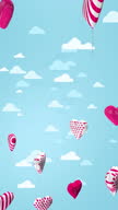 istock Valentine background. Red and white heart-shaped balloons flying upwards against light blue sky with moving clouds. Vertical video. 3D animation 1455539344