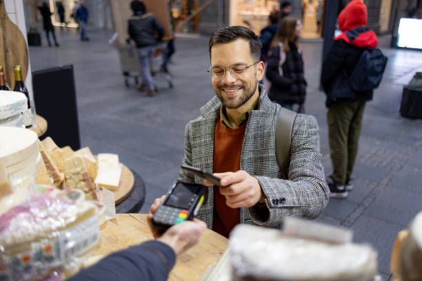 istock Buying some cheese from a local cheese vendor 1455542921