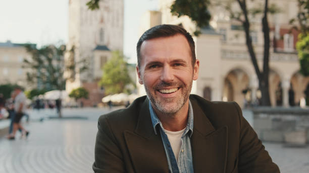 istock Close-up of man looking at the camera and smiling 1455542989