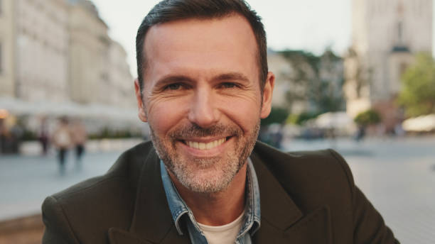 istock Close-up of man looking at the camera and smiling 1455542993