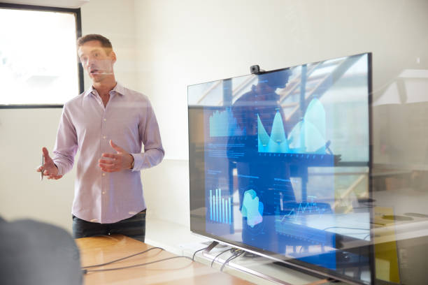 istock Presentation in modern office by handsome marketing manager 1455543693