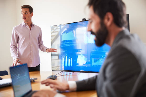 istock Confidently responding to questions regarding graphs during business presentation 1455543699