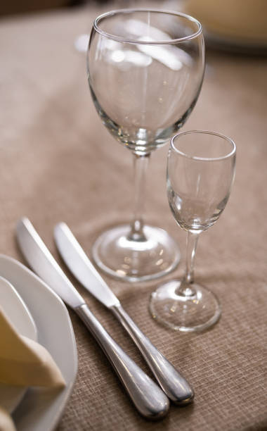istock empty goblets and other cutlery are served on the festive table. 1455545482