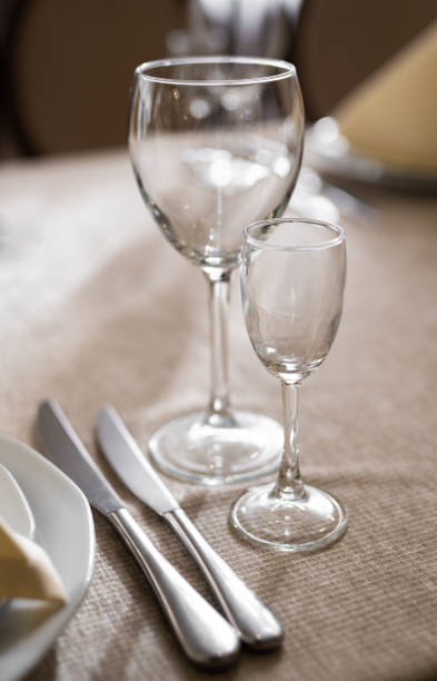istock empty goblets and other cutlery are served on the festive table. 1455545483