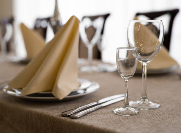 istock empty goblets and other cutlery are served on the festive table. 1455545489