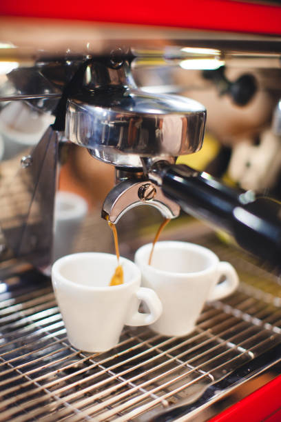 istock barista makes coffee in a coffee machine 1455545532