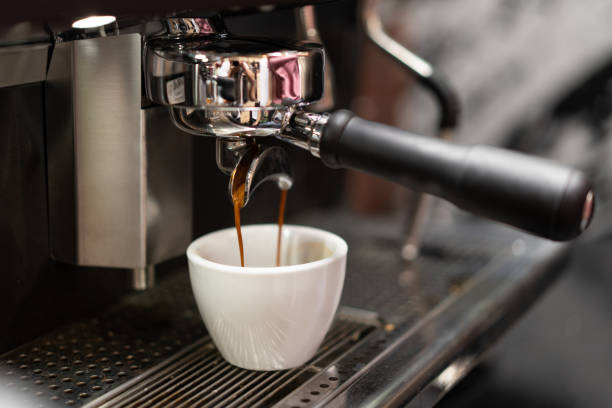 istock barista makes coffee in a coffee machine 1455545598