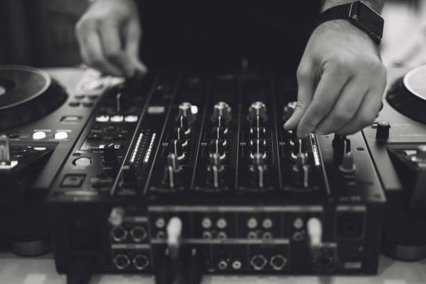 istock a DJ plays music on a controller at a party. 1455546052
