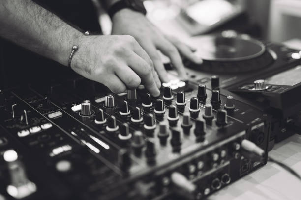 istock a DJ plays music on a controller at a party. 1455546054