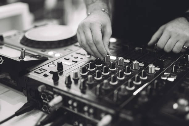 istock a DJ plays music on a controller at a party. 1455546073