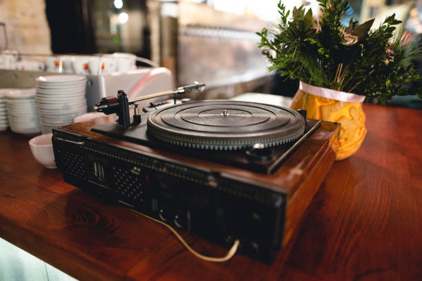 istock old retro vinyl record player on the table. 1455546601