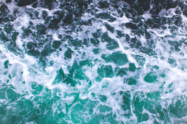 istock sea waves of green water top view 1455547085