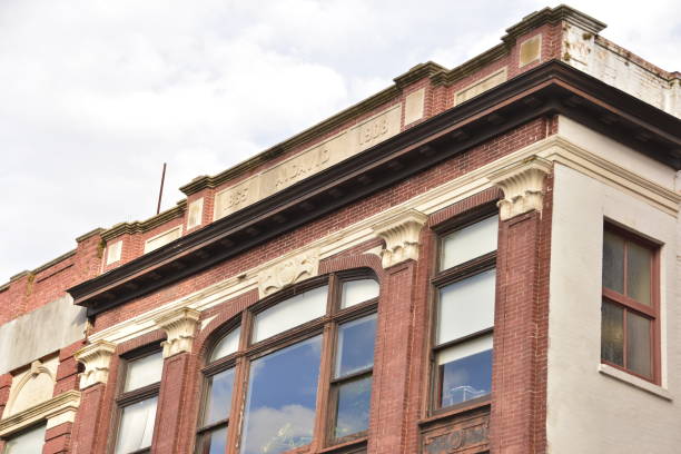 istock Old Red Brick Building With Large Windows 1455547315