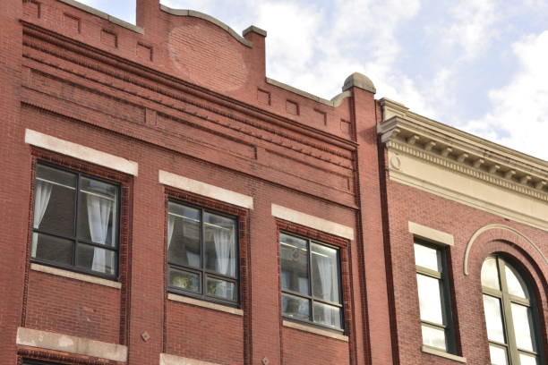 istock Sun Shining On Retro Red Brick Building 1455547400