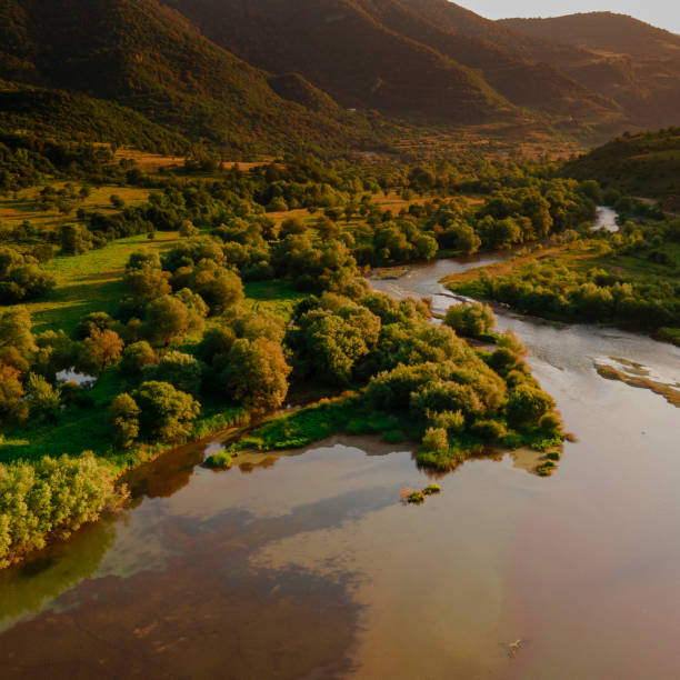 istock River flowing through a mountainous area on a warm sunny day 1455548946