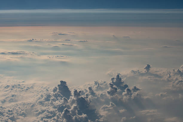 istock beautiful fluffy clouds from the window of the plane 1455549143