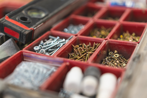 many different screws in the  organizer of master for work