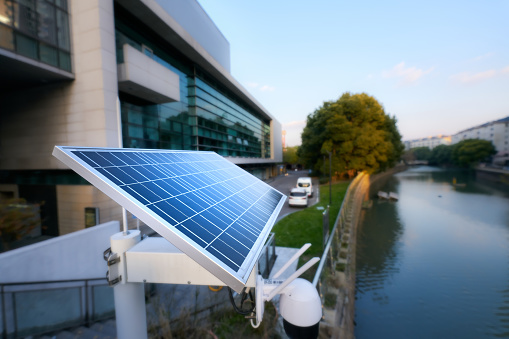 Solar surveillance footage in front of a modern office building