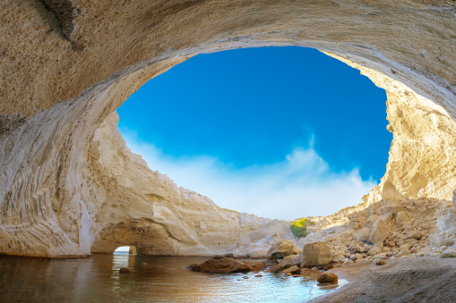 View of the volcanic open cave of Sykia, Milos island, Cyclades, Greece. High quality photo