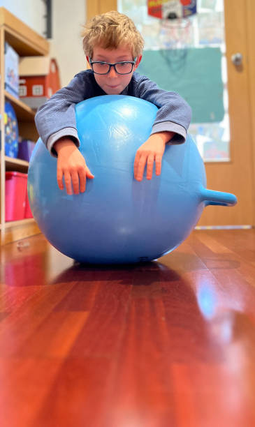 istock Child playing with a giant bouncing ball 1455553640