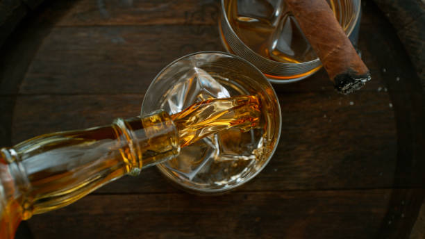 istock Close-up of pouring whiskey or rum 1455554363
