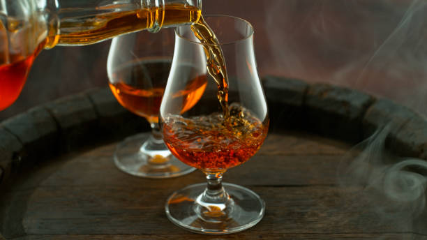 istock Close-up of pouring whiskey or rum 1455554389