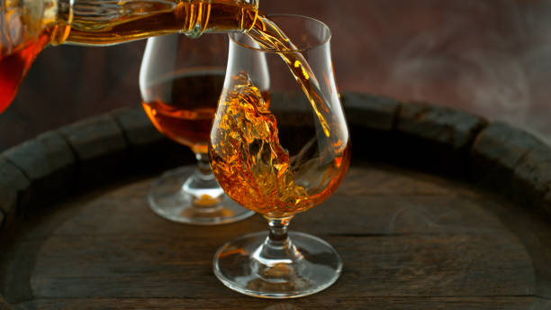 istock Close-up of pouring whiskey or rum 1455554516