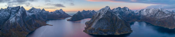 istock Sunset aerial panoramic view on sharp mountain peaks of Lofoten 1455558181