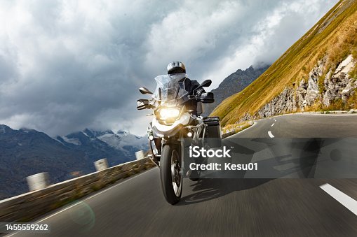 istock Motorbiker riding in Austrian Alps 1455559262