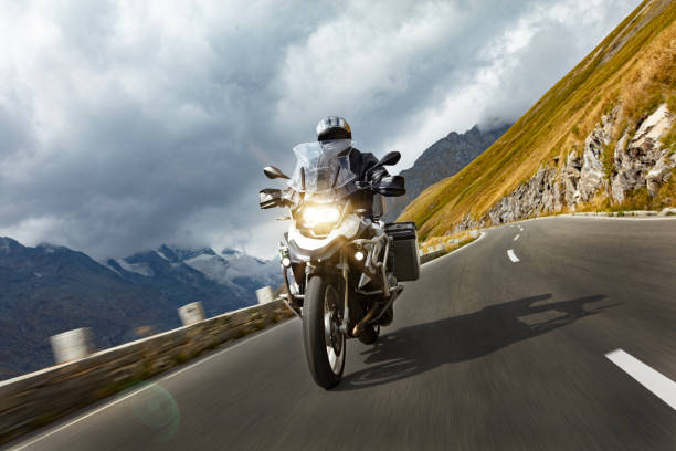 Motorbiker riding in Austrian Alps stock photo