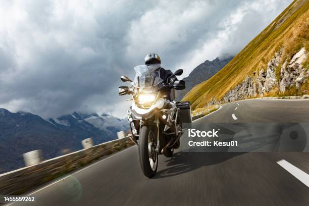 Motorbiker Riding In Austrian Alps Stock Photo - Download Image Now - Motorcycle, Biker, Adventure