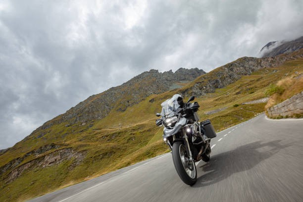 istock Motorbiker riding in Austrian Alps 1455559280